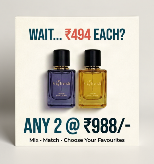 Promotional product graphic for Fragtrends perfume bottles. Two rectangular glass perfume bottles with black caps are shown on a light beige background, one with deep purple liquid and one with golden yellow liquid.