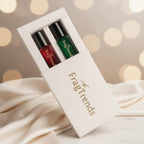 Two small bottles of perfume in a white box with 'FragTrends' branding on a light gray background.