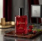 Red perfume bottle with 'FragTrends' branding on a marble surface.