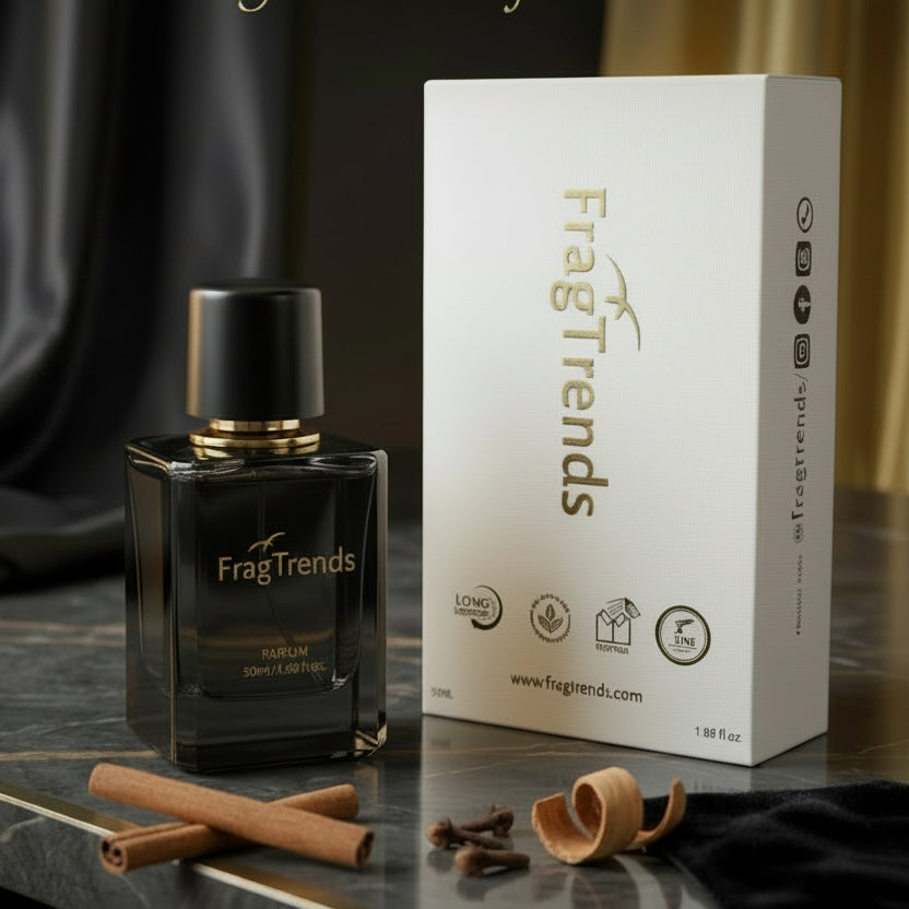 FragTrends perfume bottle and packaging on a dark surface with 'L'Essence de Luxe' branding.